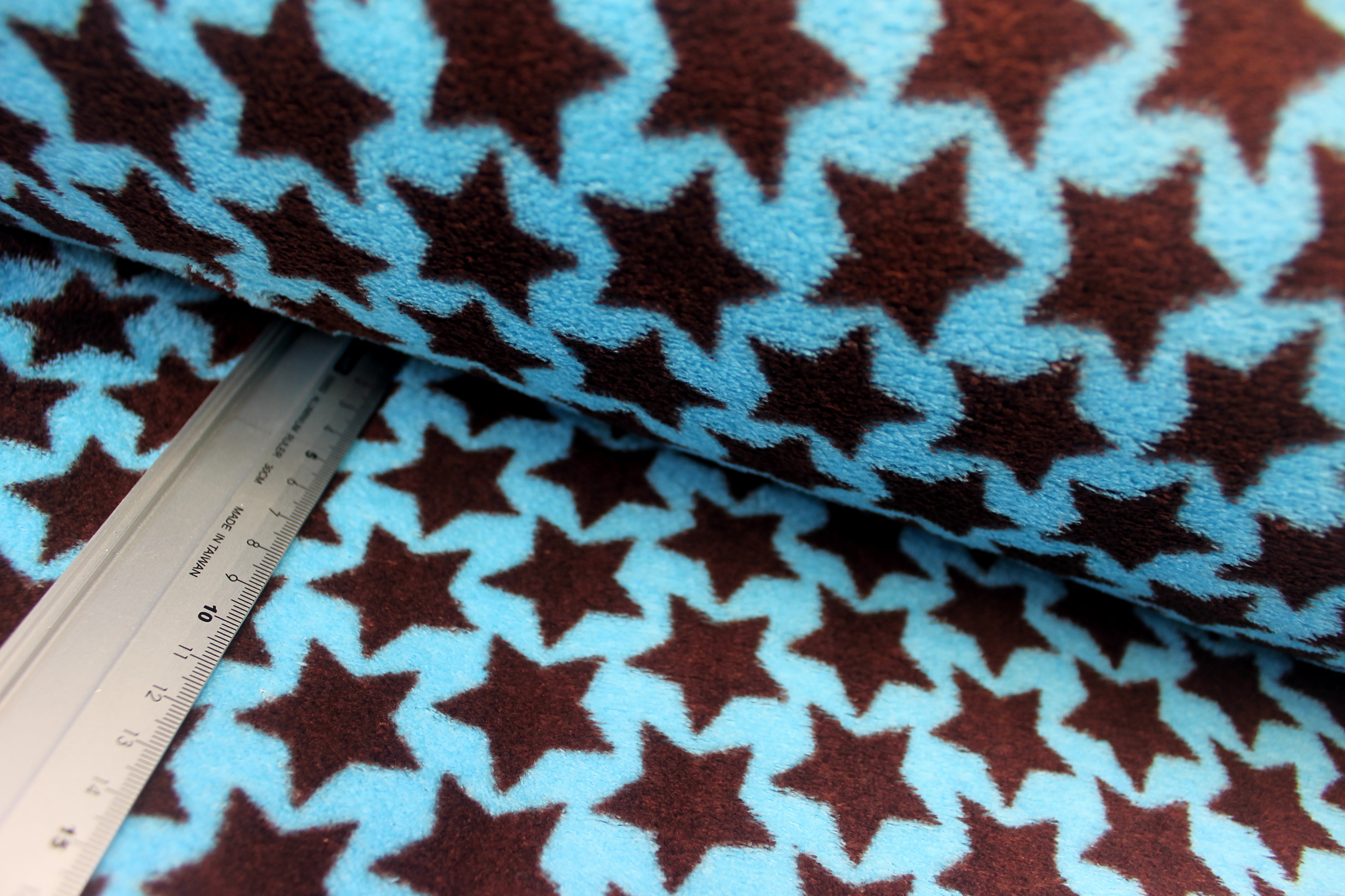 Wellnessfleece | bedruckt | braune Sterne | hellpetrol