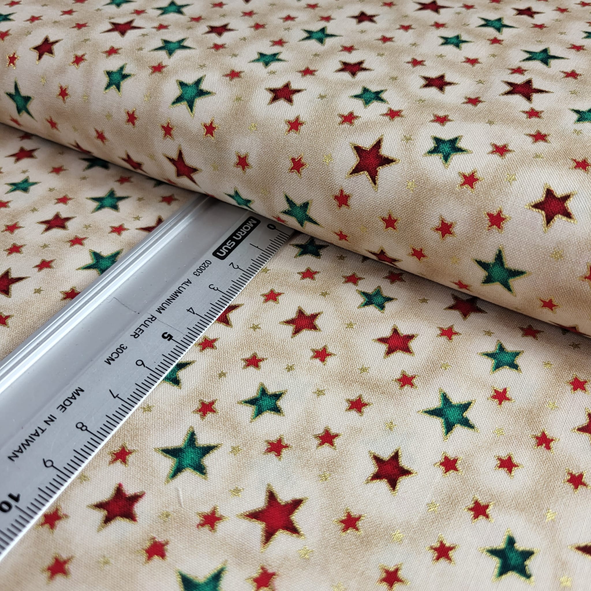 Baumwolle | bedruckt | bunte Sterne | foliert | sand