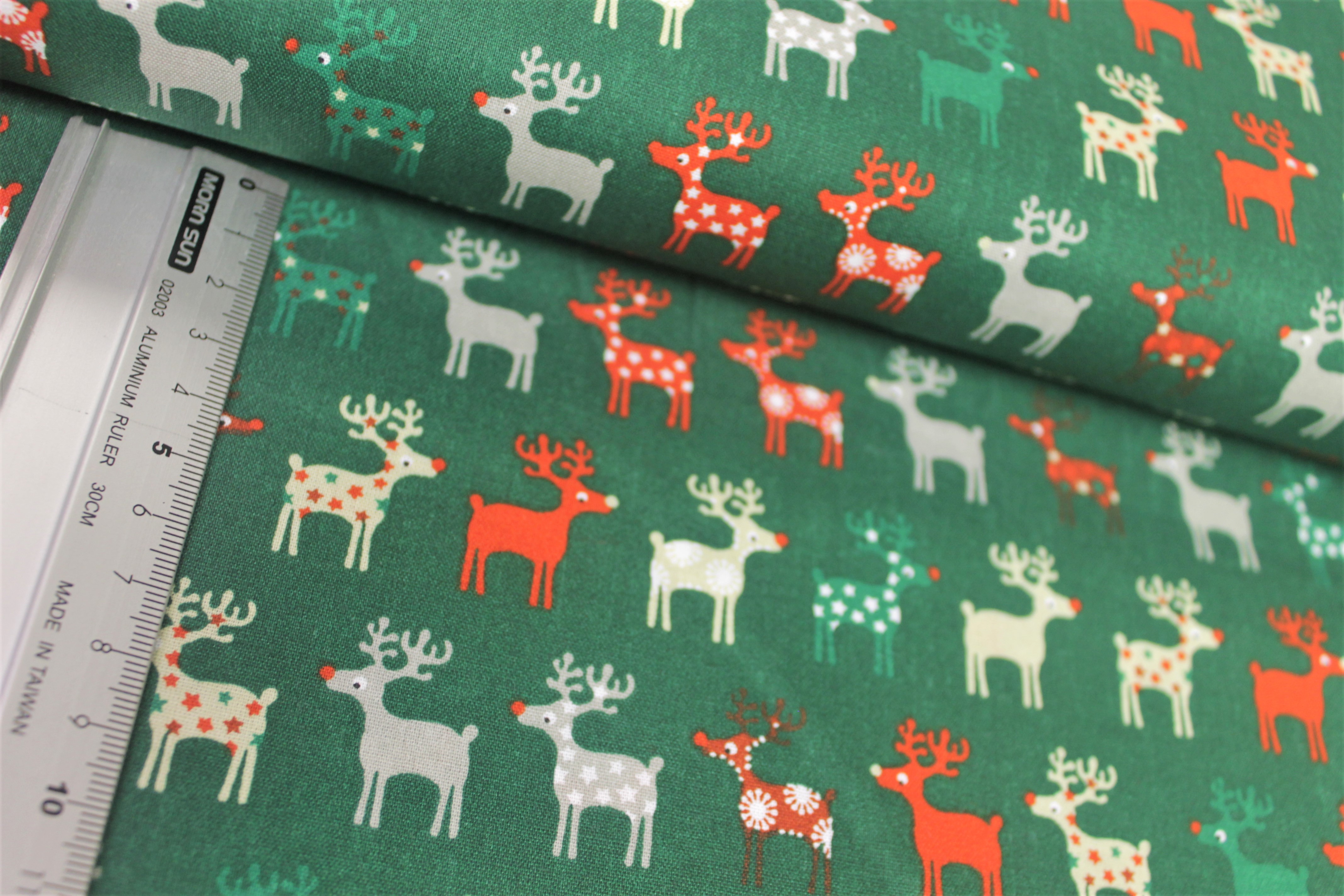 Baumwolle | bedruckt | bunte Elche | grün